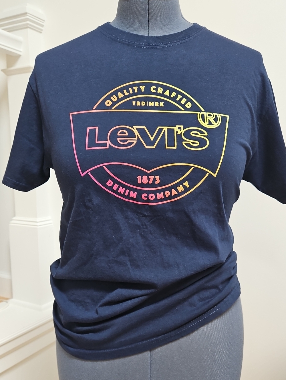 Levi's Navy Tee with Pink-to-Yellow Gradient Logo